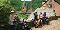 Walkers resting in Conques on the Way of St James, France