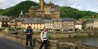 Walkers on the Way of St James, France, leaving Estaing