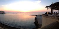 Share romantic sunsets in Gallipoli, Puglia, from an outdoor bar