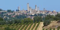 Medieval villages such as San Gimignano are surrounded by Tuscan produce