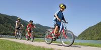 Kids riding bikes along the Danube