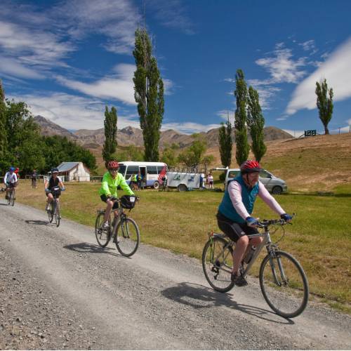 Cycling away from Cob cottage and a snack spot on the Molesworth High Country tour