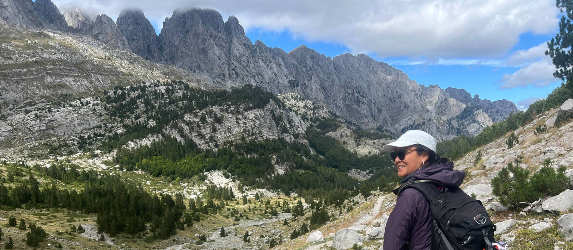 Hiker taking in the view in the Ropojana Valley Albania | Kate Baker