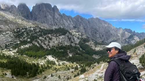 Hiker taking in the view in the Ropojana Valley Albania | Kate Baker
