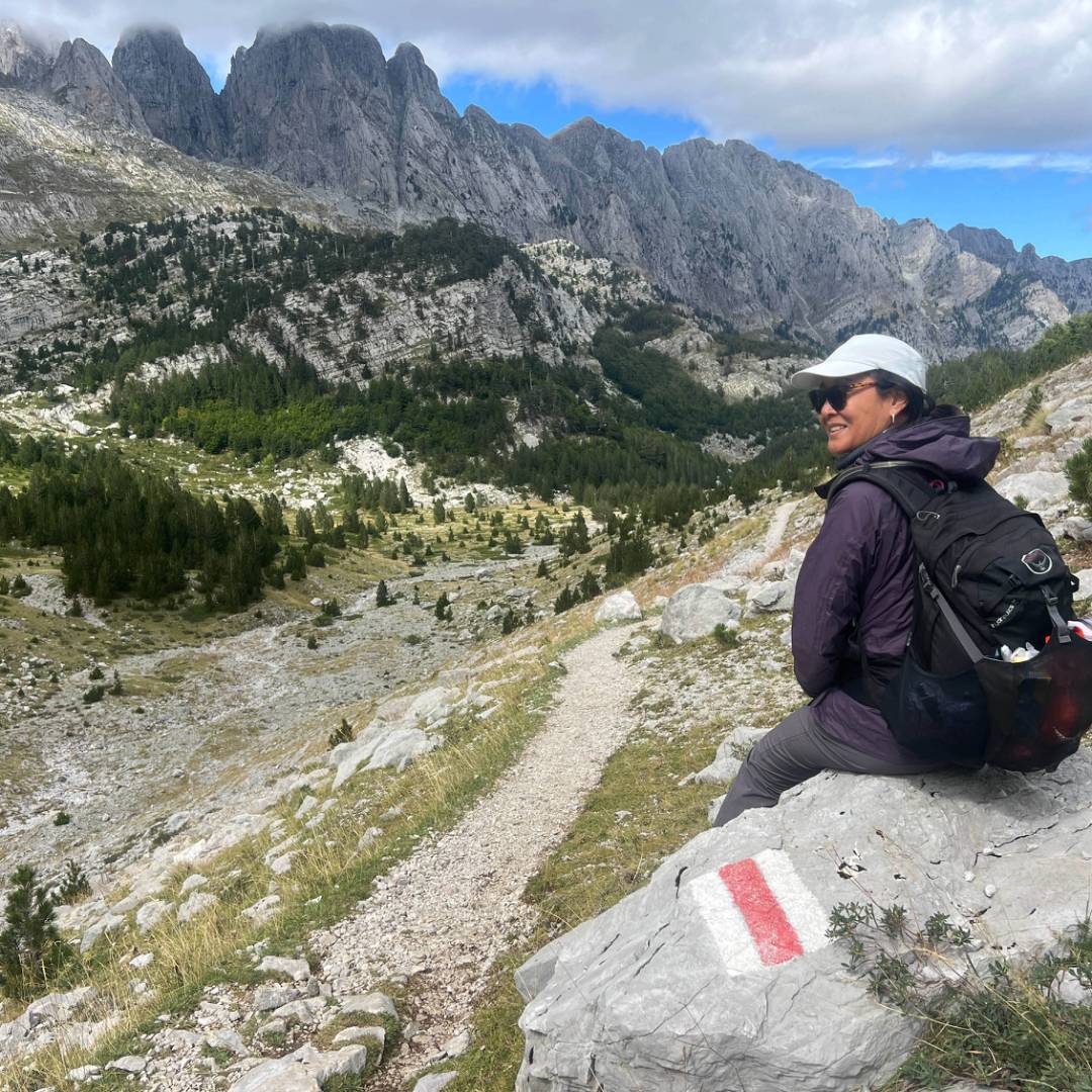 Hiker taking in the view in the Ropojana Valley Albania | Kate Baker
