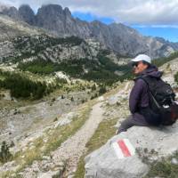 Hiker taking in the view in the Ropojana Valley Albania | Kate Baker