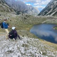 Hikers absorbing the view on the Peaks of the Balkans trail in Albania | Kate Baker