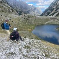 Hikers absorbing the view on the Peaks of the Balkans trail in Albania | Kate Baker