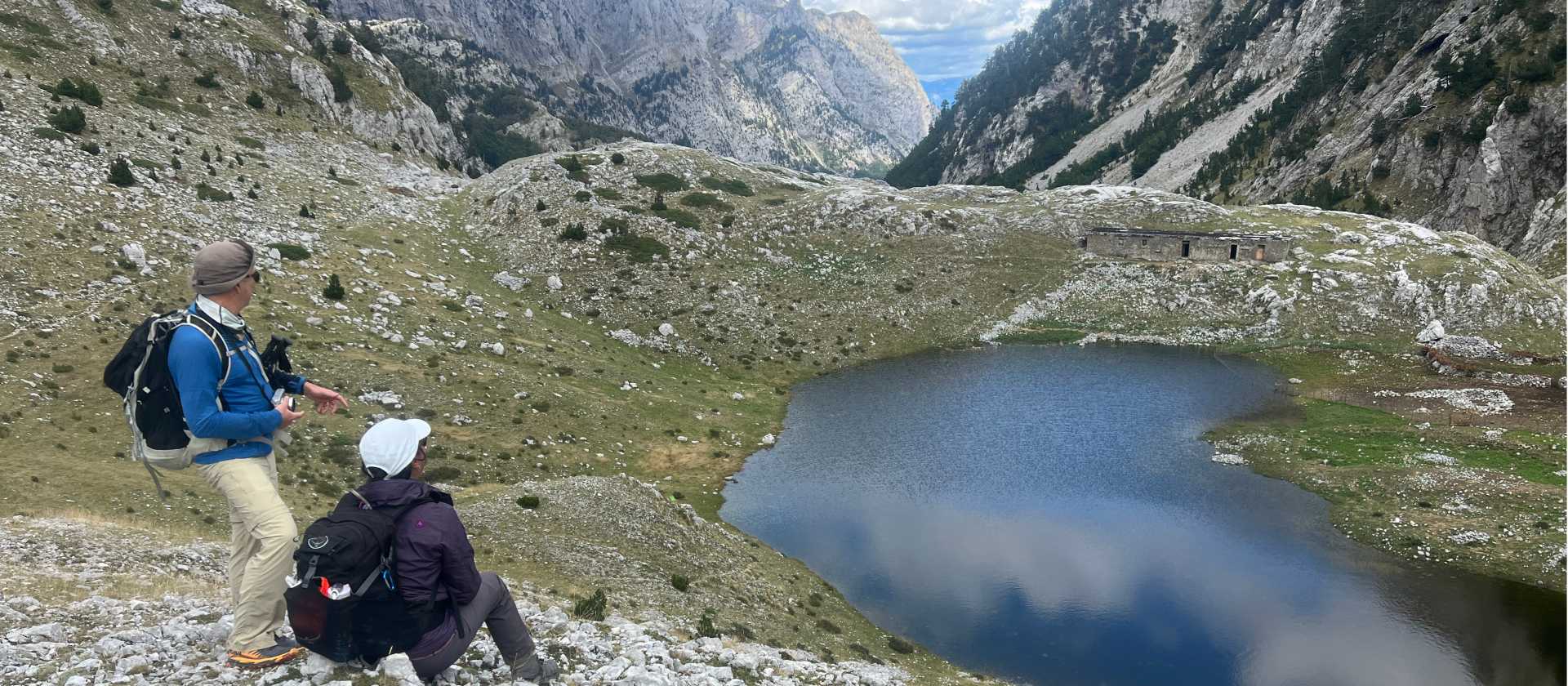 Hikers absorbing the view on the Peaks of the Balkans trail in Albania | Kate Baker