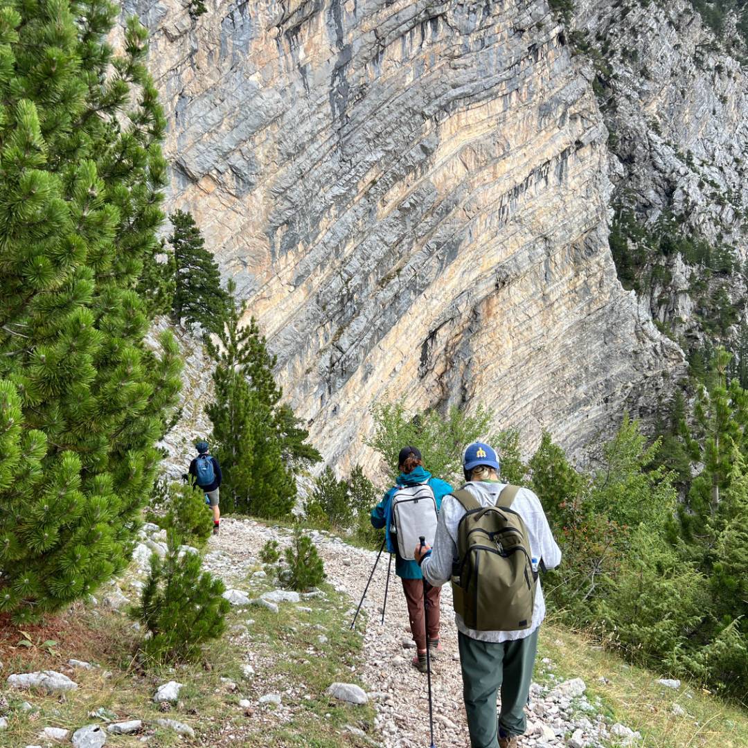 Hikers descending from the Pejë Pass to the Theth Valley | Kate Baker