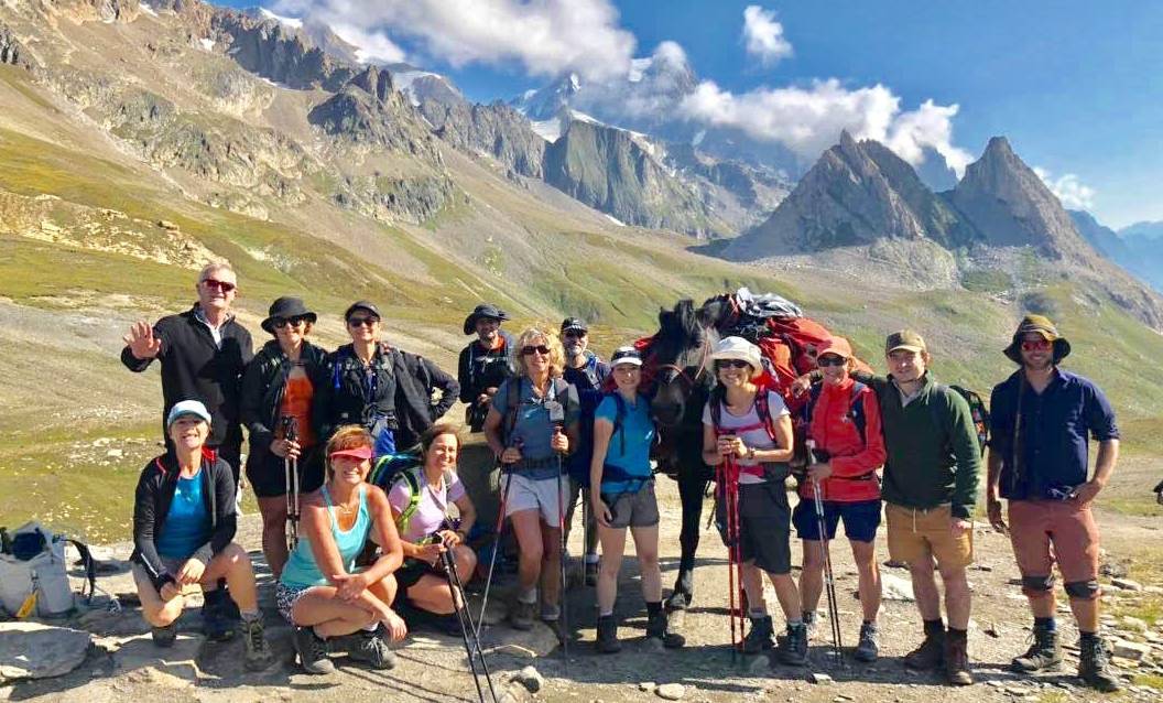 Group posing at the Italian-French border in the Alps |  <i>Ryan Graham</i>