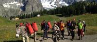 Families walking with donkeys beneath the lofty heights of Mont Blanc | Kate Baker