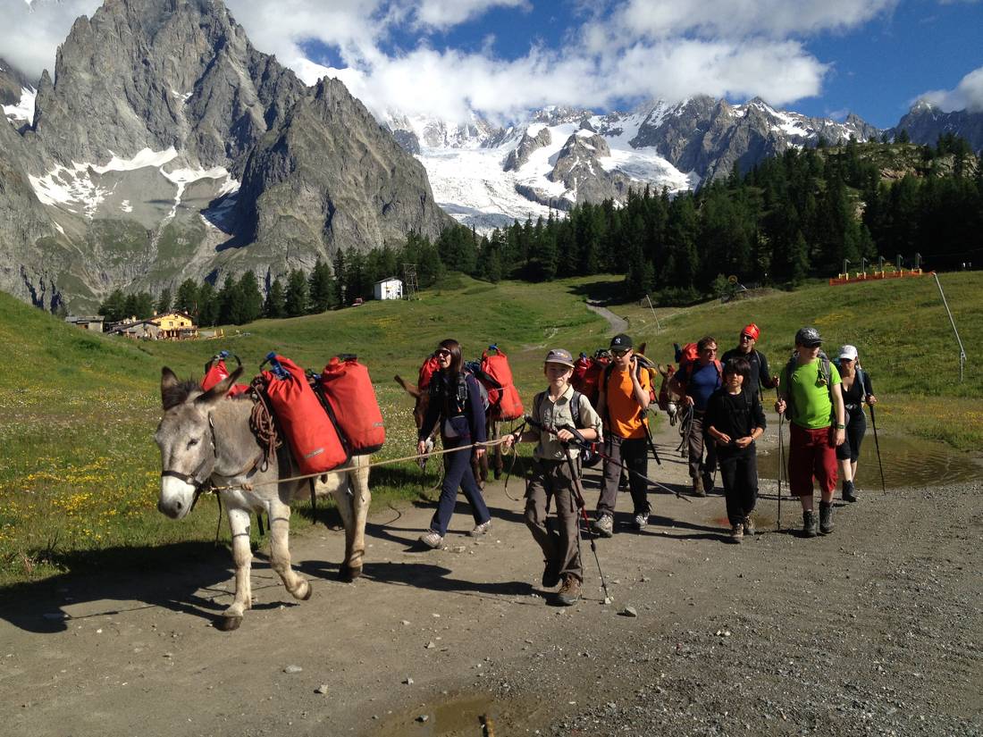 Families walking with donkeys beneath the lofty heights of Mont Blanc |  <i>Kate Baker</i>