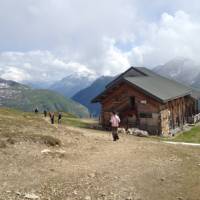 Hikers descending to the Bonhomme Refuge in the French Alps | Kate Baker