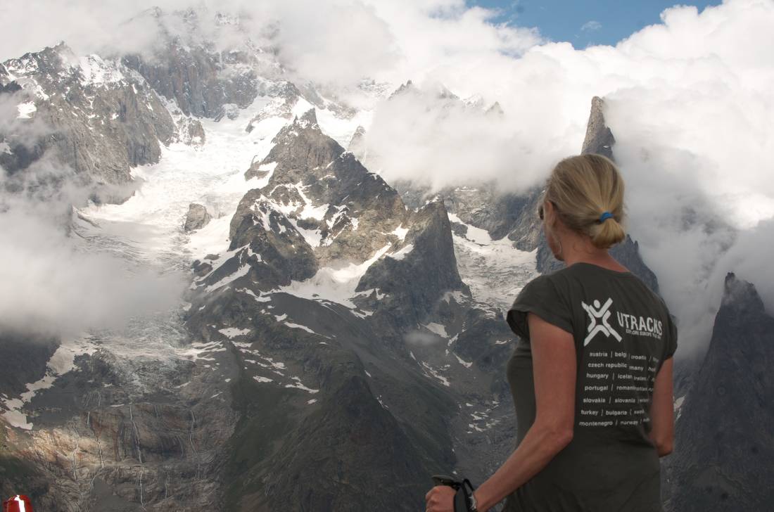 UTracks staff member on balcony trail overlooking Mont Blanc and glaciers Italy |  <i>Kate Baker</i>