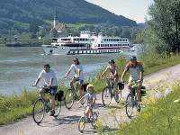 Family cycling along Danube