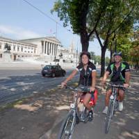 Cycling past Parliament in Vienna
