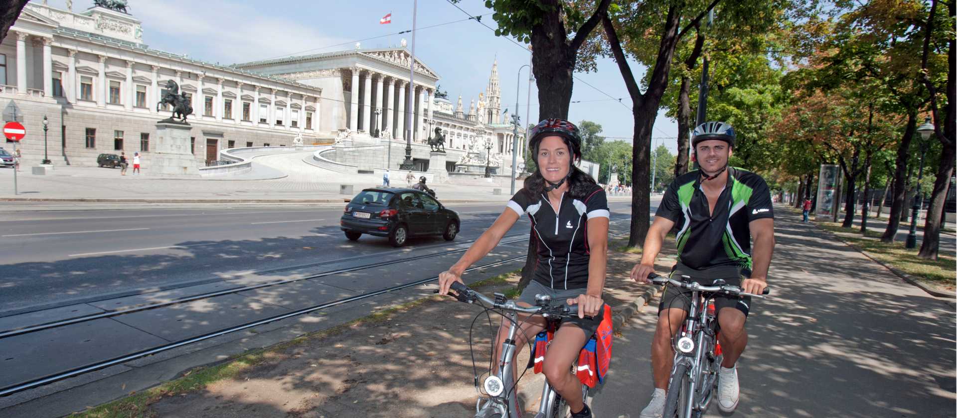 Cycling past Parliament in Vienna