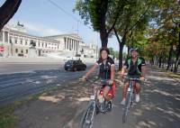 Cycling past Parliament in Vienna