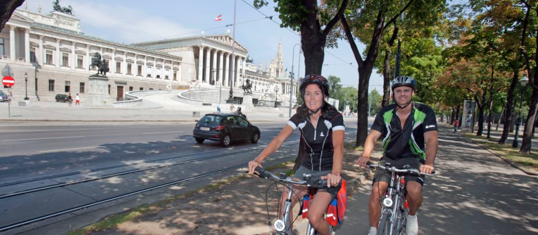 Cycling past Parliament in Vienna