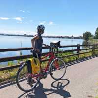 Taking in a view of the sea on the Alpe Adria Cycle Path
