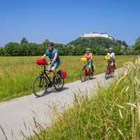 Cyclists with the Hellbrunner Fortress in the background