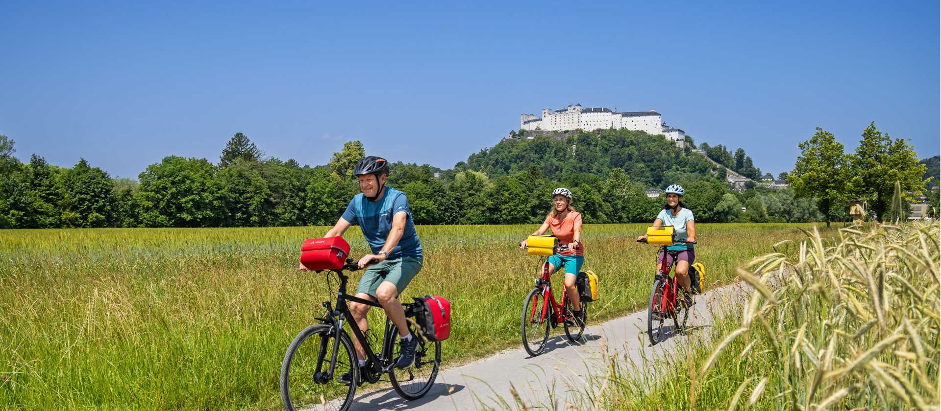 Cyclists with the Hellbrunner Fortress in the background