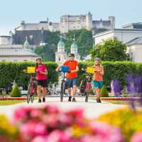 Cyclists leaving Salzburg from the Mirabell Gardens
