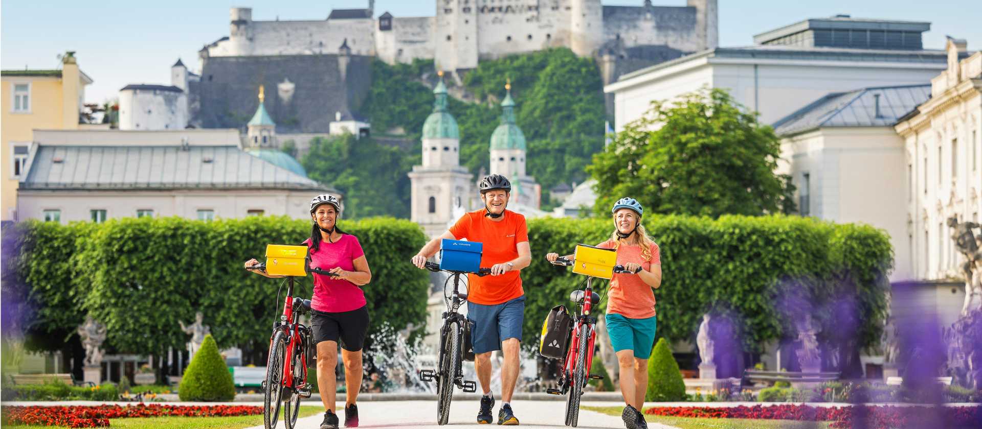 Cyclists leaving Salzburg from the Mirabell Gardens