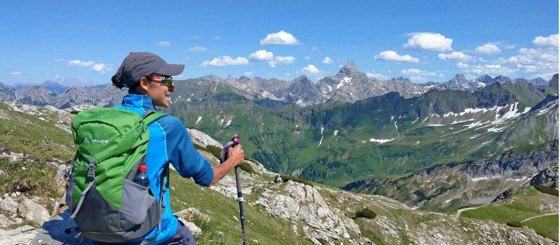 Hiker overlooking Oberstdorf from the Nebelhorn in the Allgäu Alps