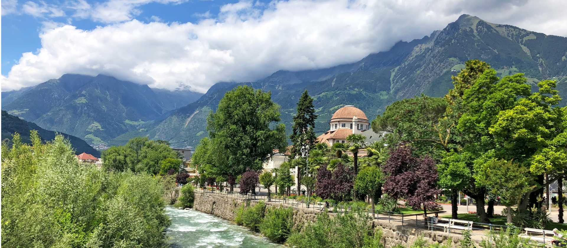 The Passer River winds through the heart of Merano, framed by alpine peaks