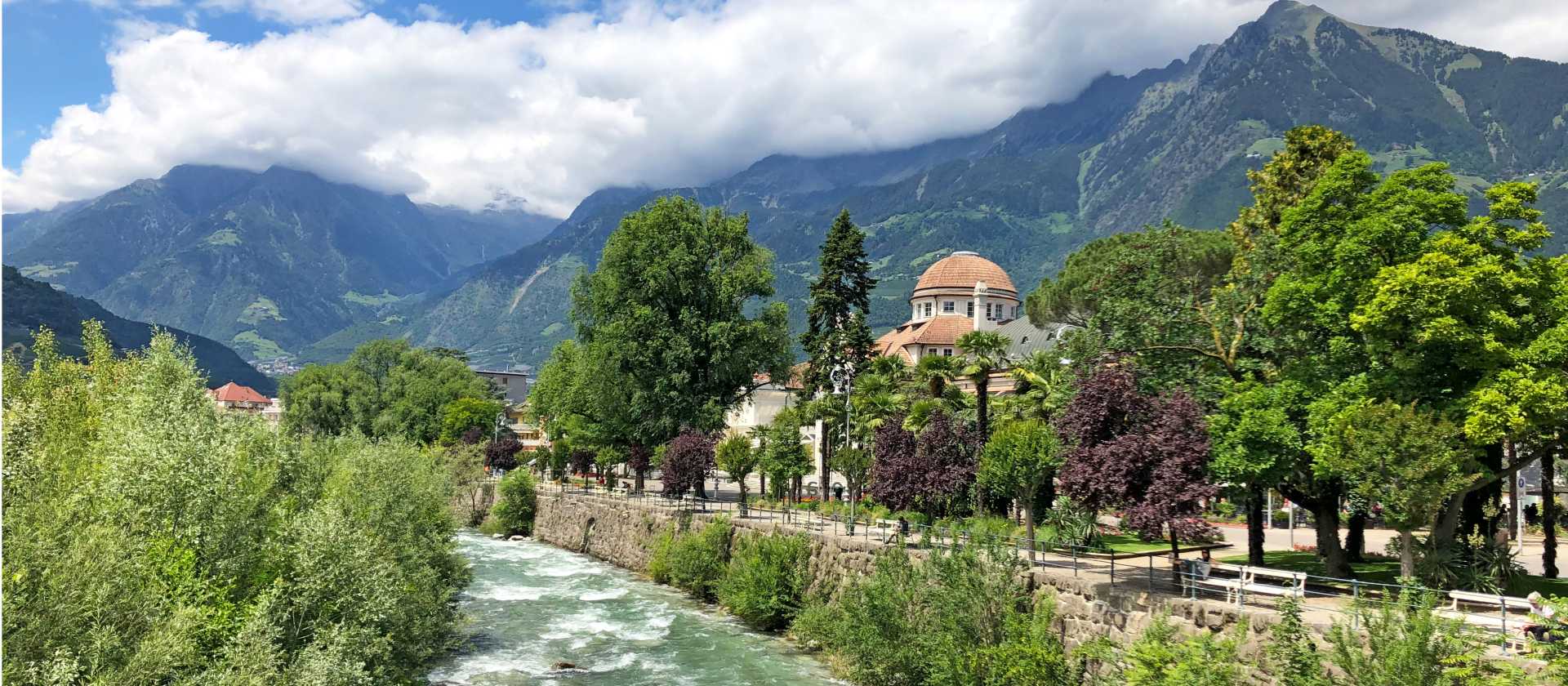 The Passer River winds through the heart of Merano, framed by alpine peaks