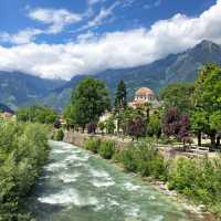The Passer River winds through the heart of Merano, framed by alpine peaks