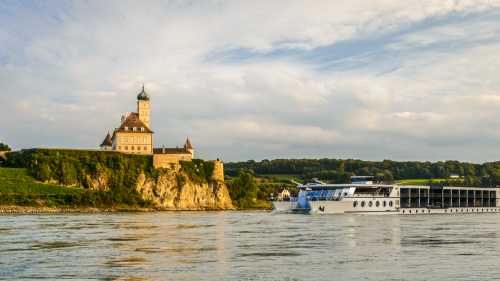 Barge crossing by Schonbuhel Castle on the Danube river