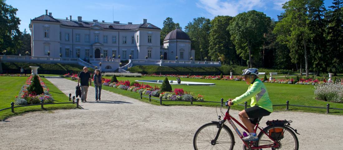 Cycling past the palace in Palanga, Lithuania | <i>Andrew Bain</i>