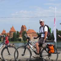 Cyclists in front of Trakai Castle, Lithuania