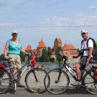 Cyclists in front of Trakai Castle, Lithuania