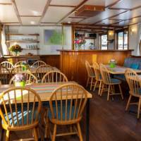 Dining tables on board Flora