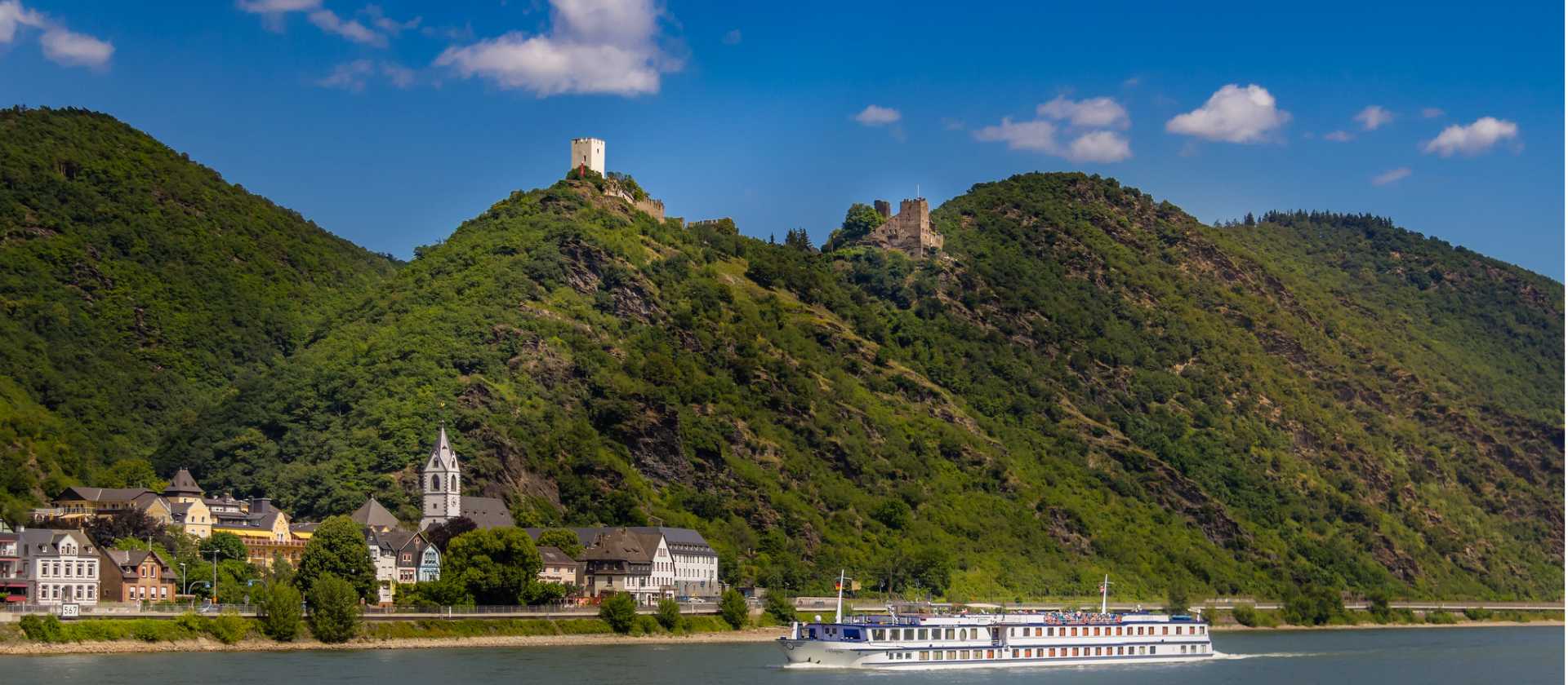 MS Olympia sails past a castle