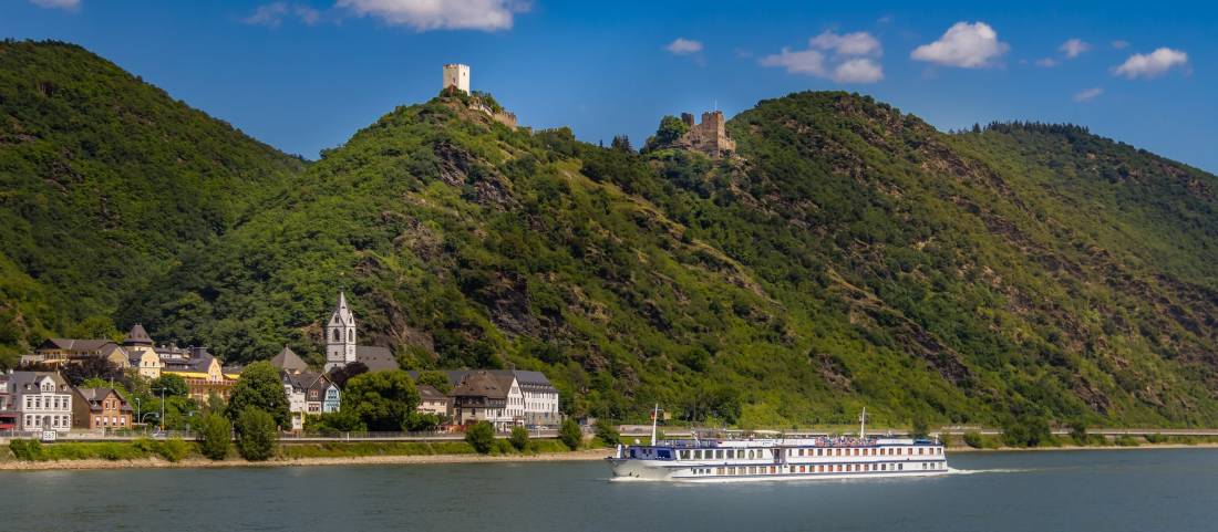 MS Olympia sails past a castle