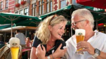 A happy couple enjoying their holiday in Bruges.