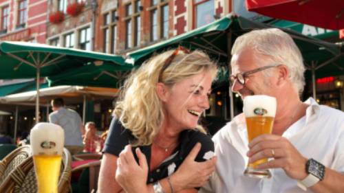 A happy couple enjoying their holiday in Bruges.