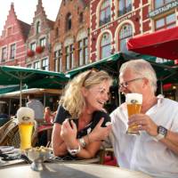 A happy couple enjoying their holiday in Bruges.