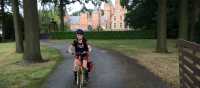 Young cyclist outside a castle near Ghent | Hilary Delbridge