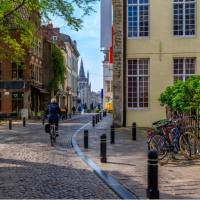 Cycle through the pretty town of Ghent in Belgium