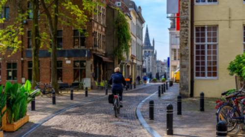 Cycle through the pretty town of Ghent in Belgium