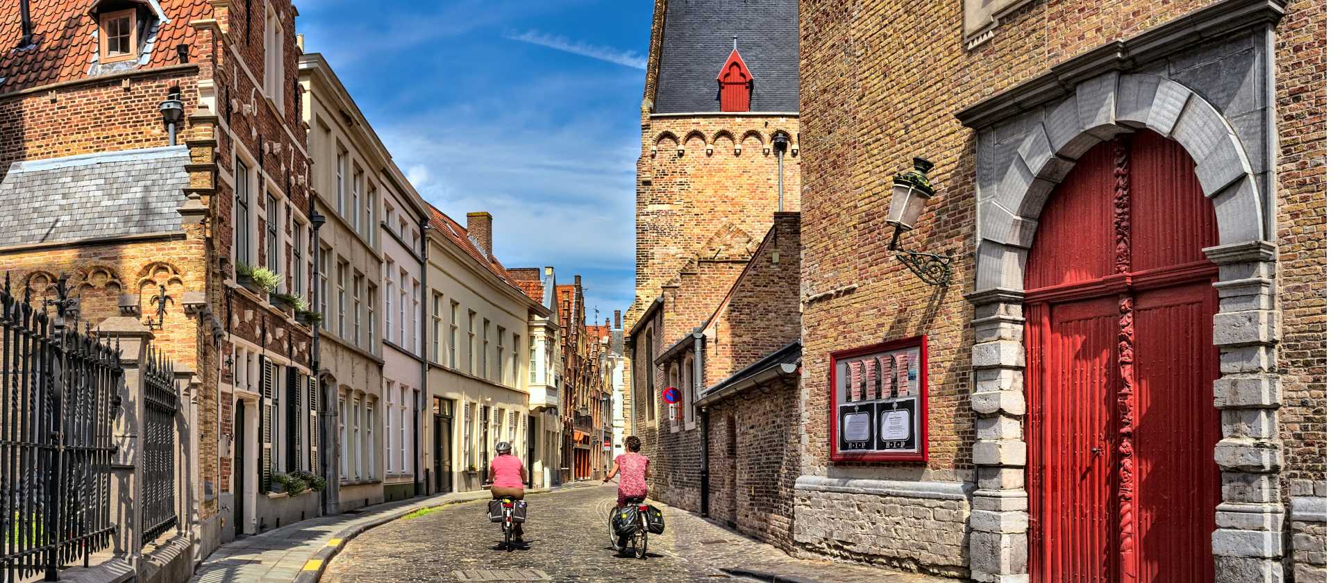 Cycling through the charming old streets of Bruges