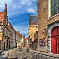 Cycling through the charming old streets of Bruges