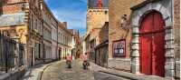Cycling through the charming old streets of Bruges