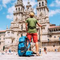 A pilgrim admires the incredible architecture of the Cathedral of Santiago de Compostela.